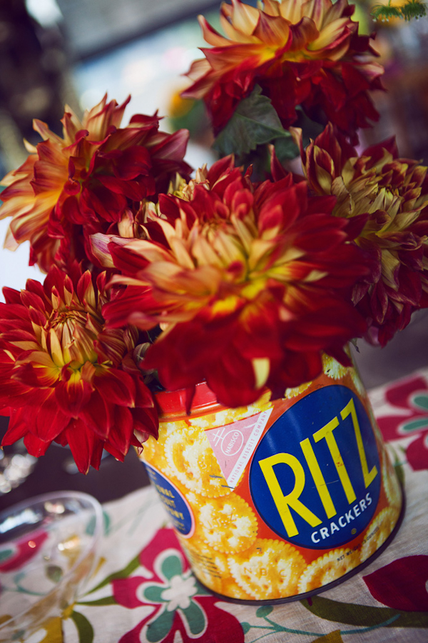 Ritz cracker tub holding red flowers - vintage LA wedding at The Smog Shoppe photo by top Orange County wedding photographer Duke Images